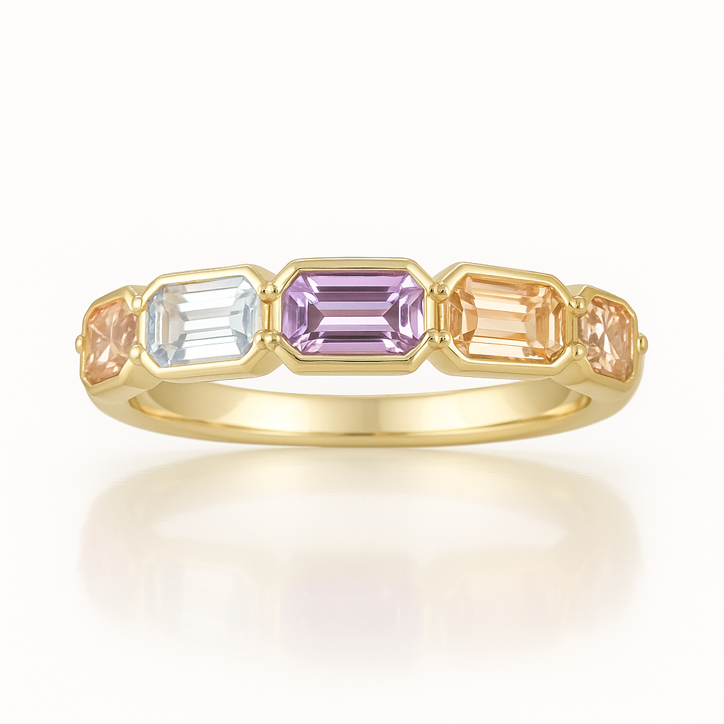 Gold ring with multicolored gemstones on a white background