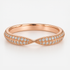Rose gold wedding ring with diamond accents on a light background