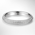 White gold wedding ring with diamond accents on a light grey background