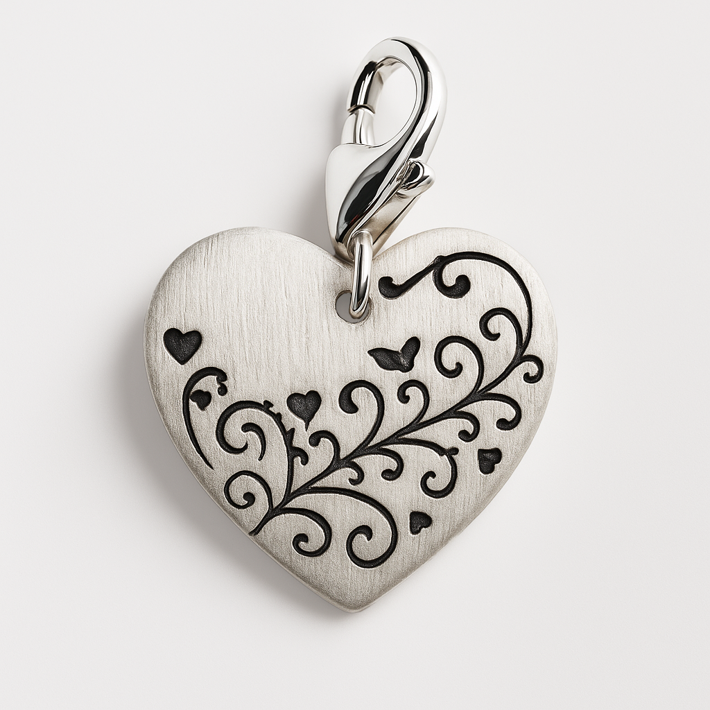 Silver satin heart-shaped pendant with black engraving on a light grey background