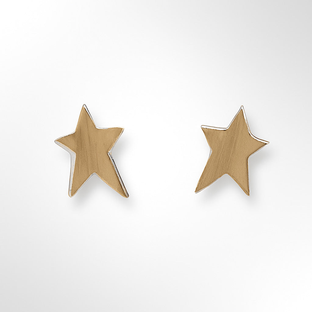 Gold star-shaped earrings on a white background