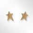 Gold star-shaped earrings on a white background