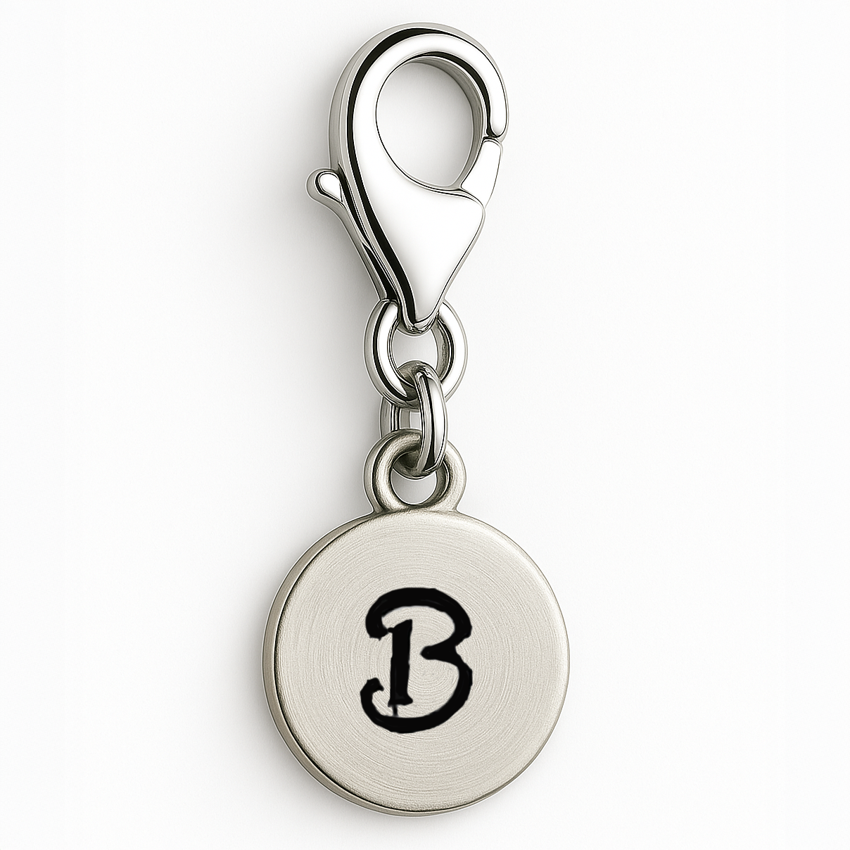 Silver charm with letter 'B' on a white background
