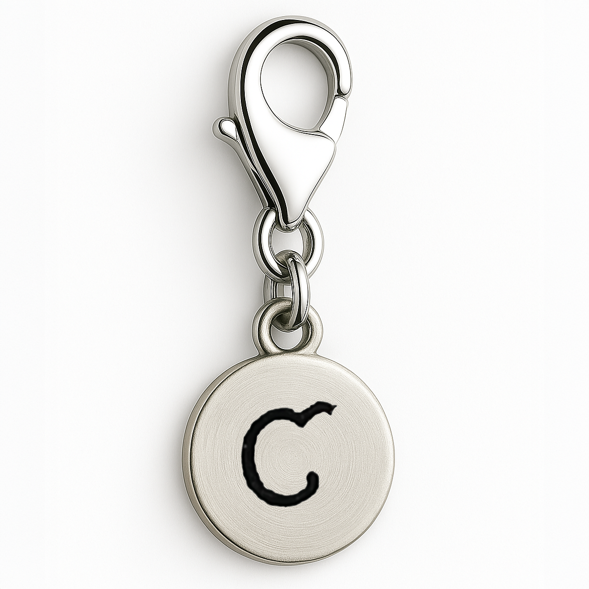 Silver charm with letter 'C' on a white background