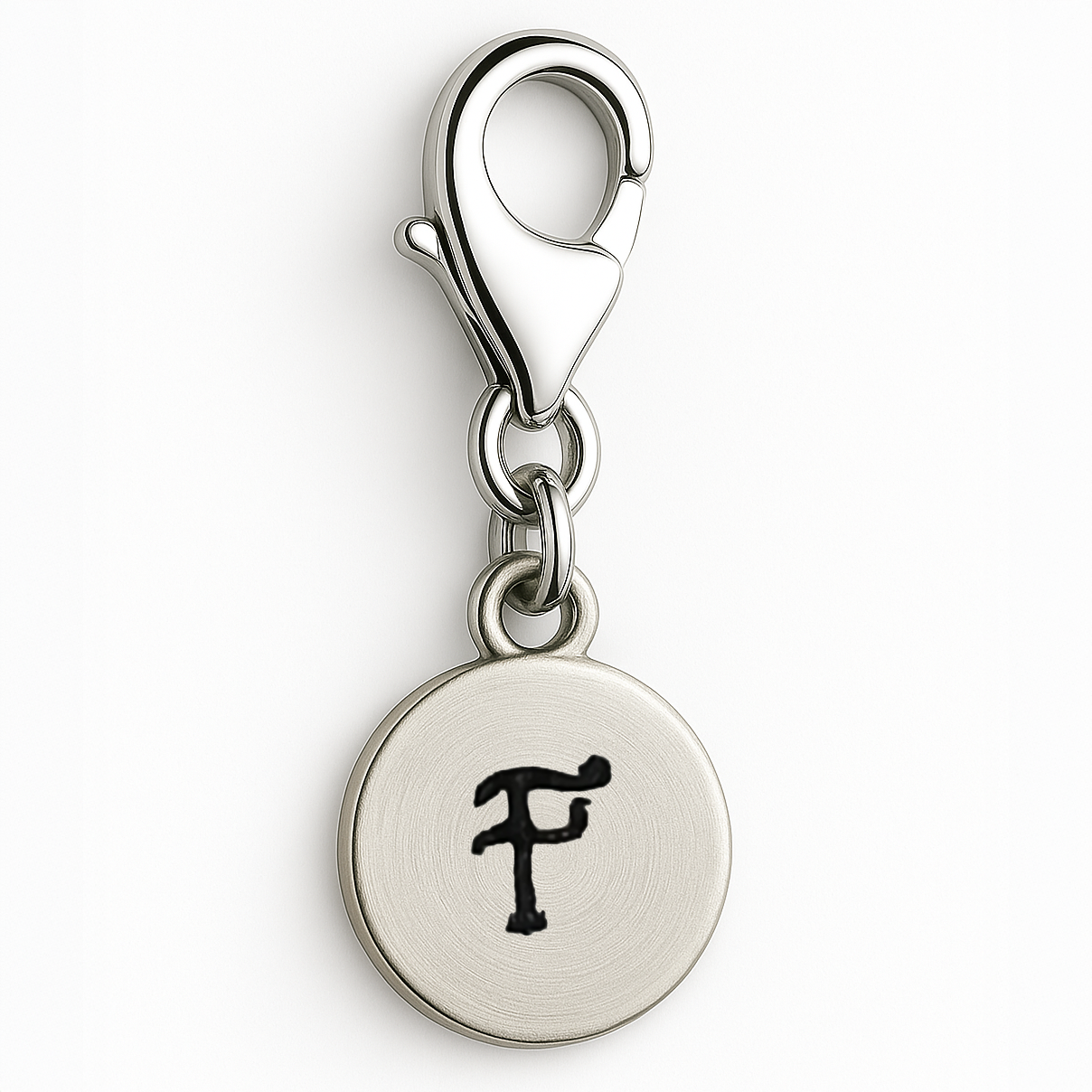 Silver charm with letter 'F' on a white background