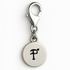 Silver charm with letter 'F' on a white background