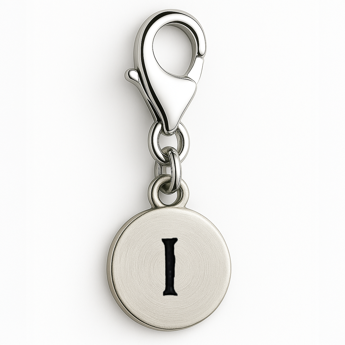 Silver charm with letter 'I' on a white background