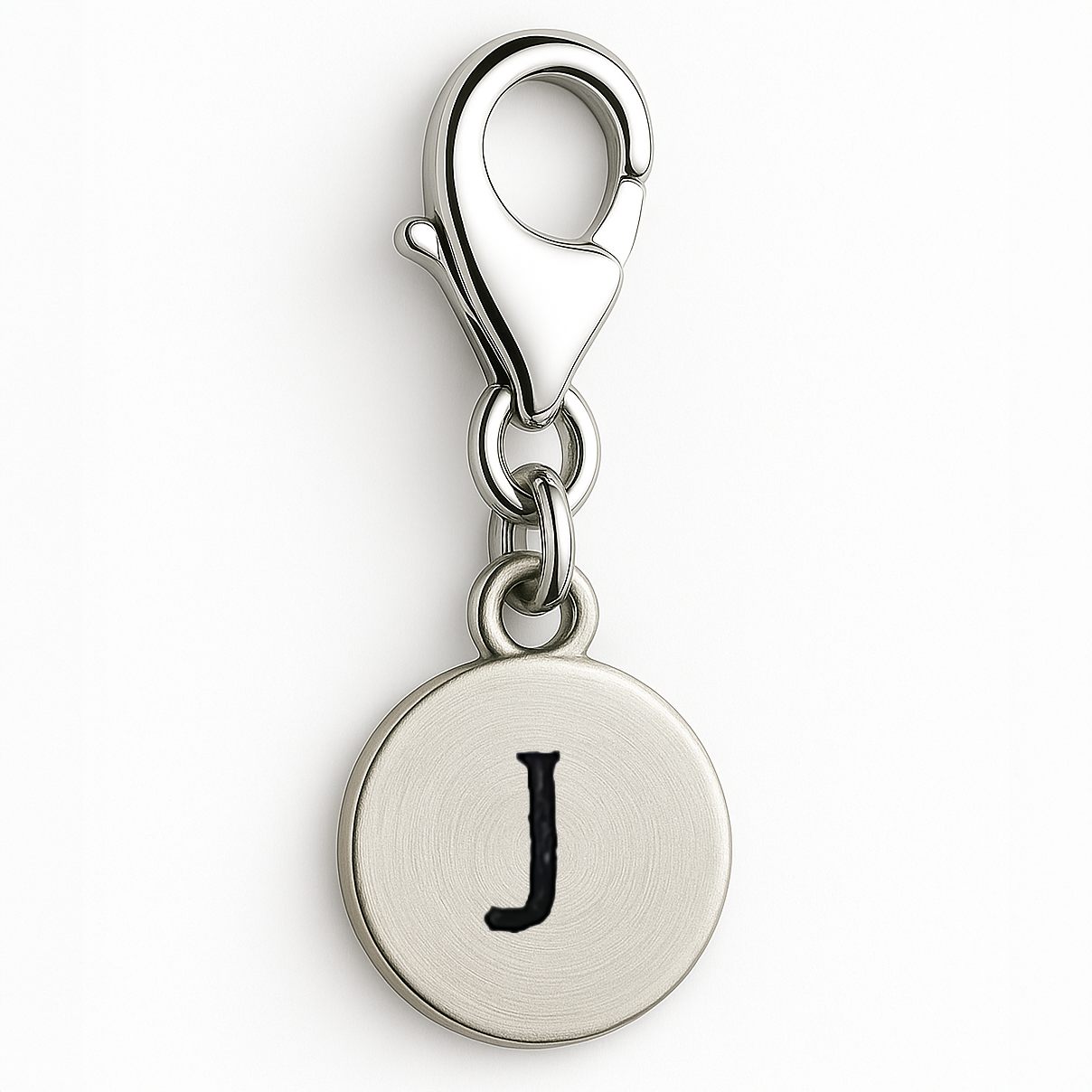 Silver charm with letter 'J' on a white background