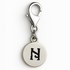 Silver charm with a black letter 'N' on a white background