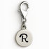 Silver charm with letter 'R' on a white background