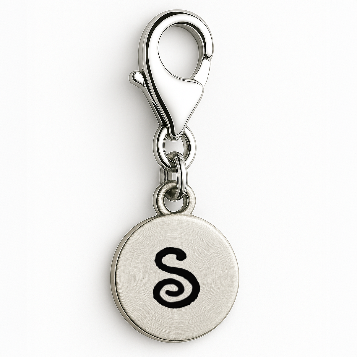 Silver charm with letter 'S' on a white background