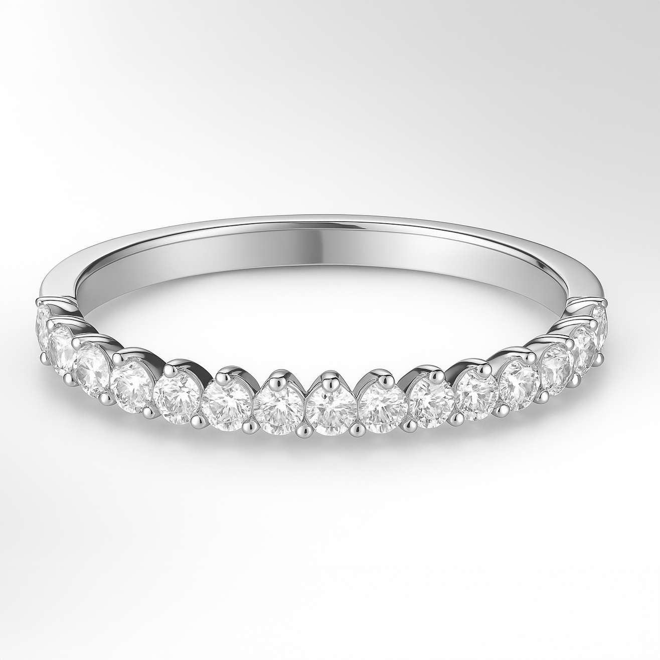 Platinum Three Claw Diamond Wedding Ring on a White Background