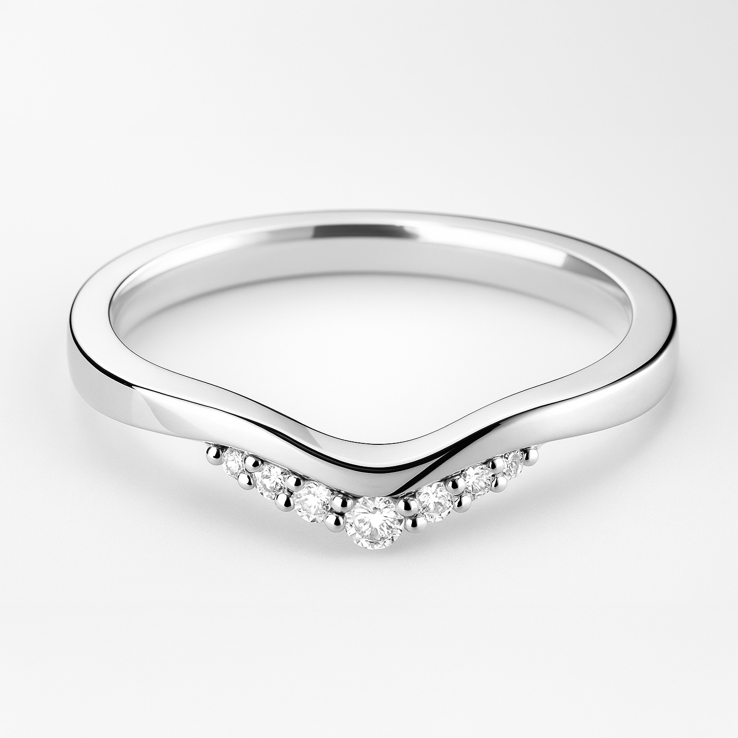 Platinum ring with diamond accents on a light background