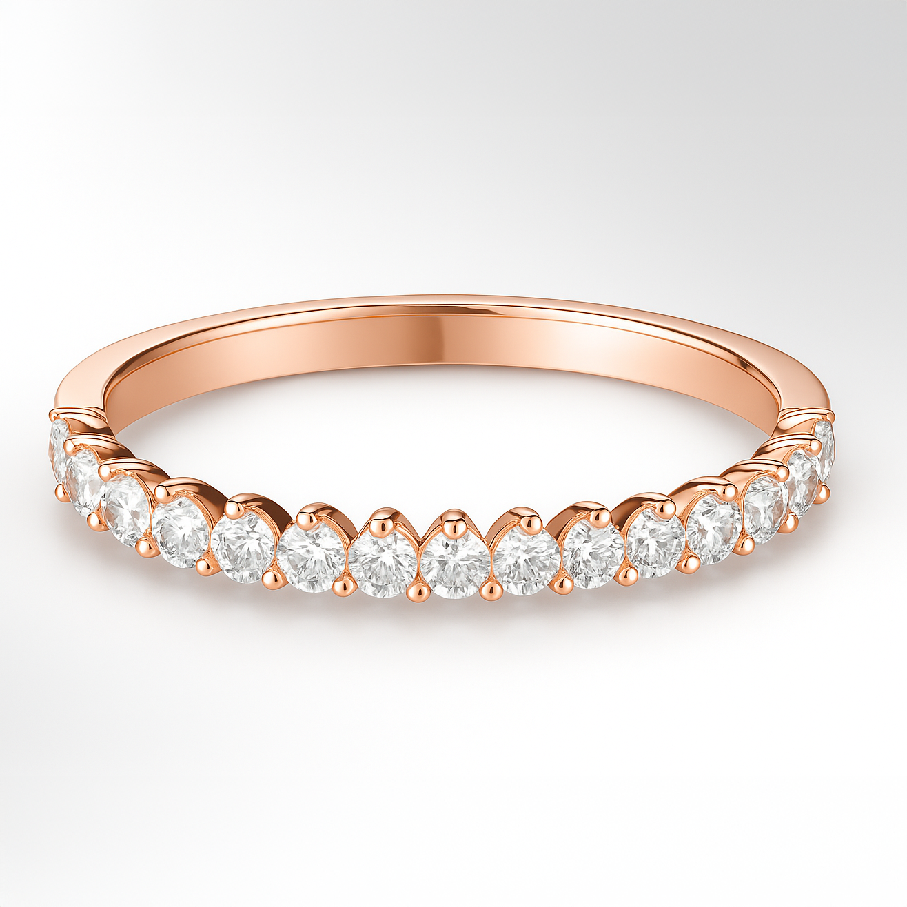 Rose Gold Three Claw Diamond Wedding Ring on a White Background