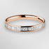 Rose Gold Princess and Baguette Diamond Ring on a Grey Background