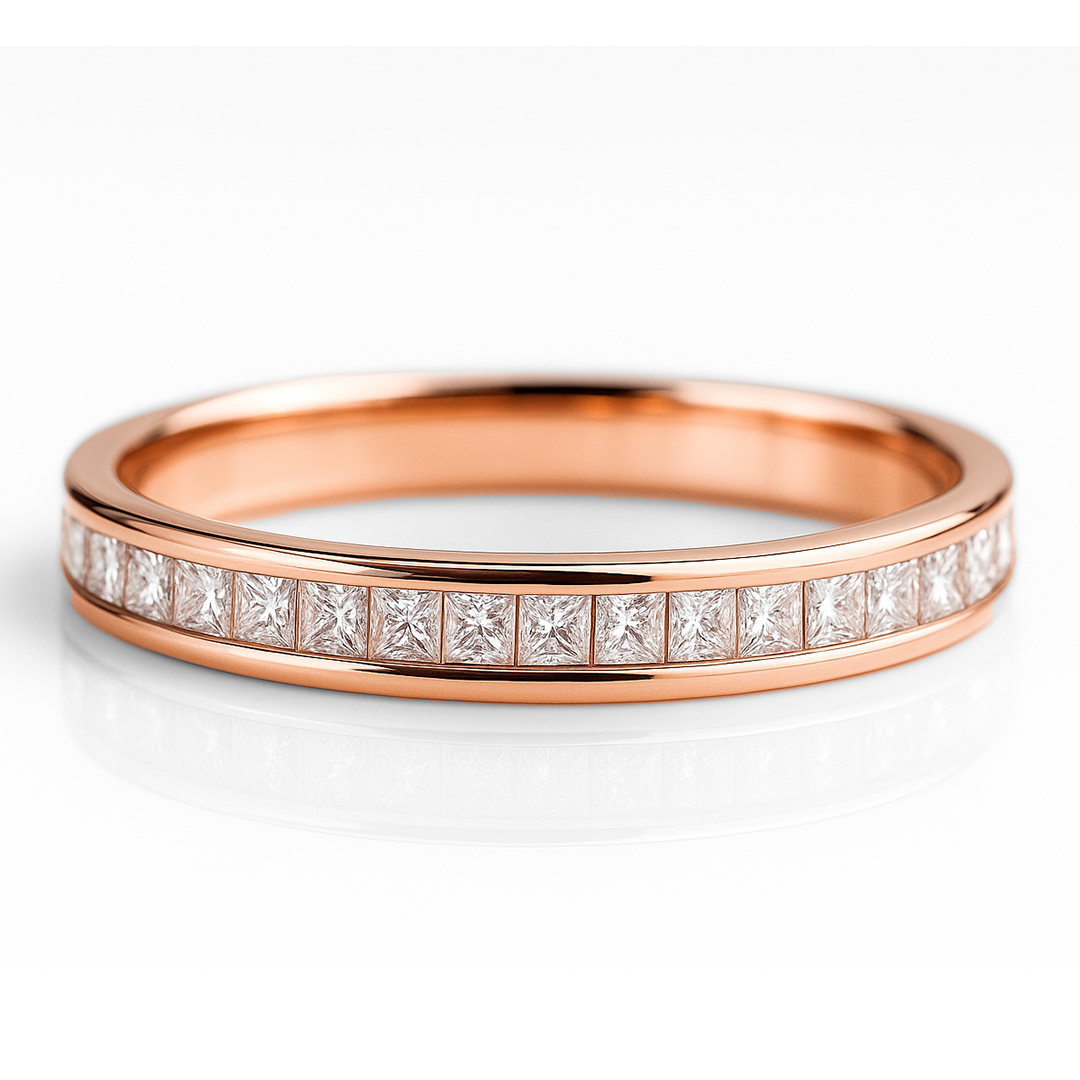 Rose gold ring with diamond accents on a white background
