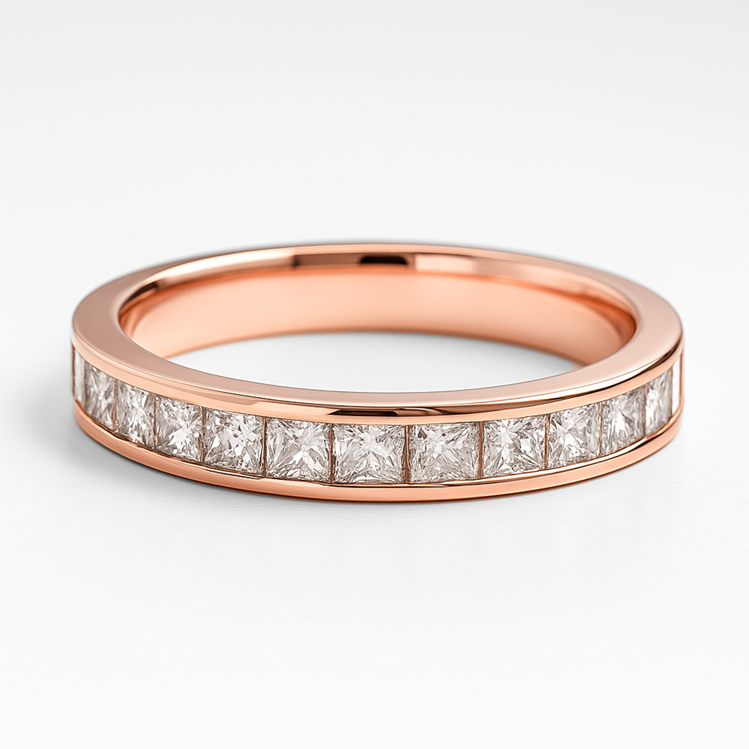 Rose gold ring with diamond stones on a light grey background