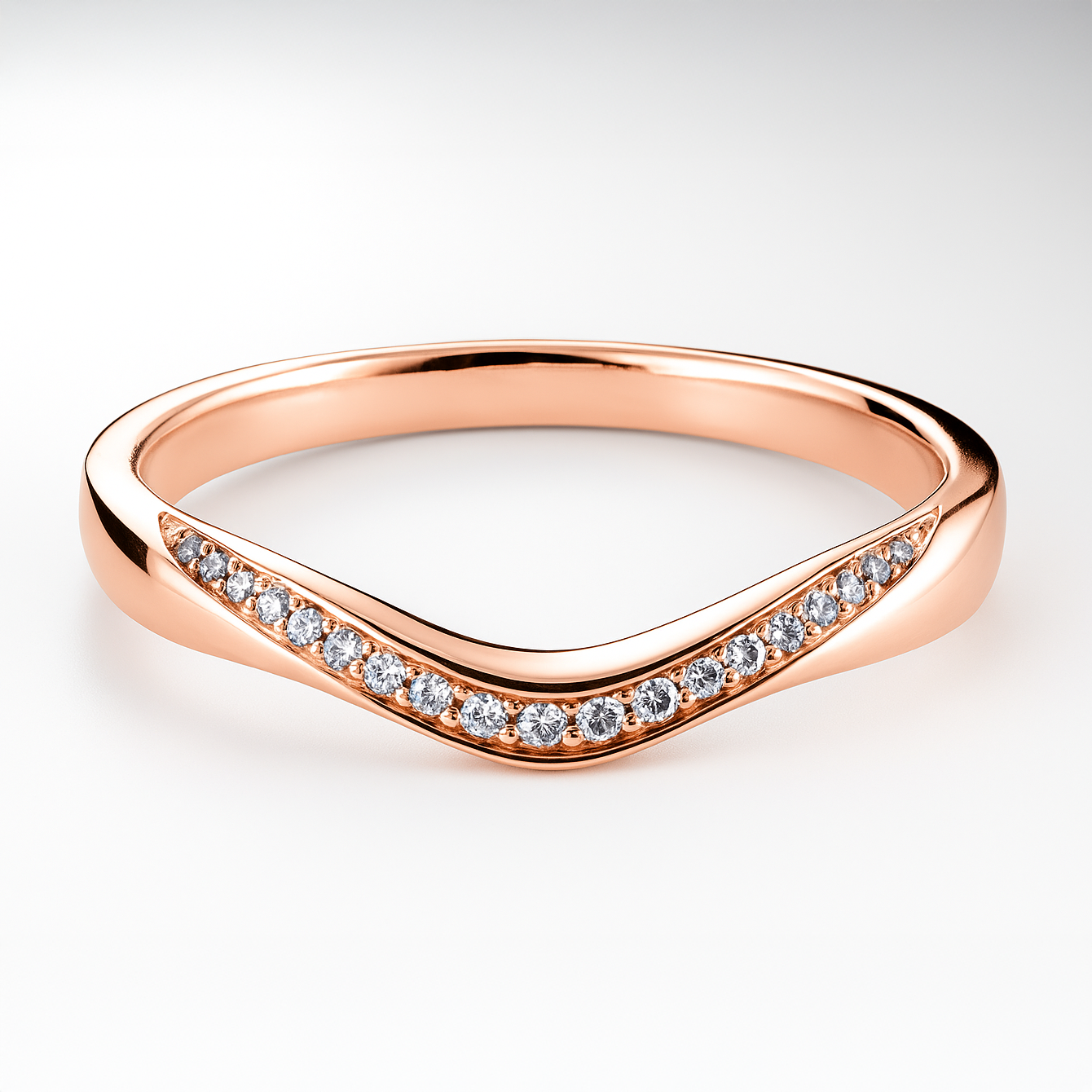 Rose gold ring with diamond accents on a light background