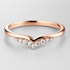 Rose gold ring with small diamonds on a light grey background