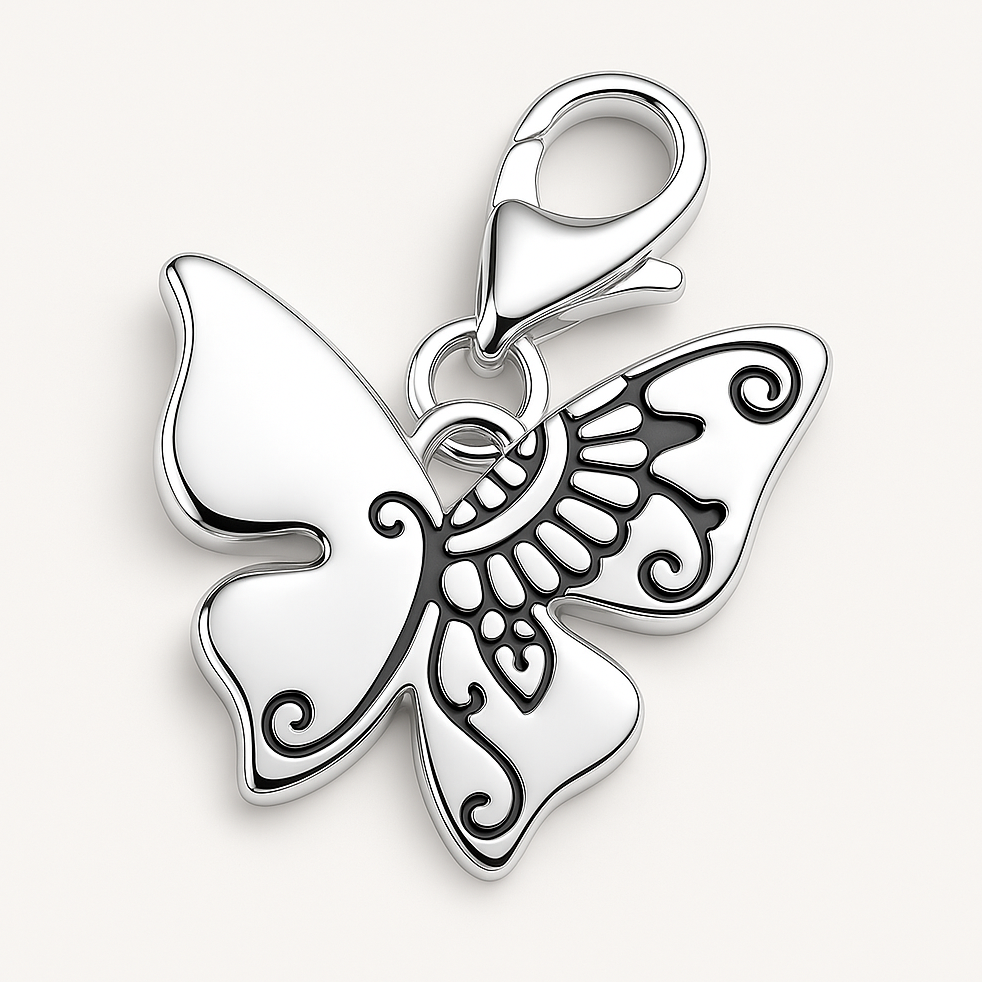 Silver polished butterfly charm on a white background