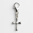 Silver cross pendant with a lobster clasp on a light grey background