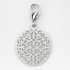 Silver pendant with intricate design on a light grey background