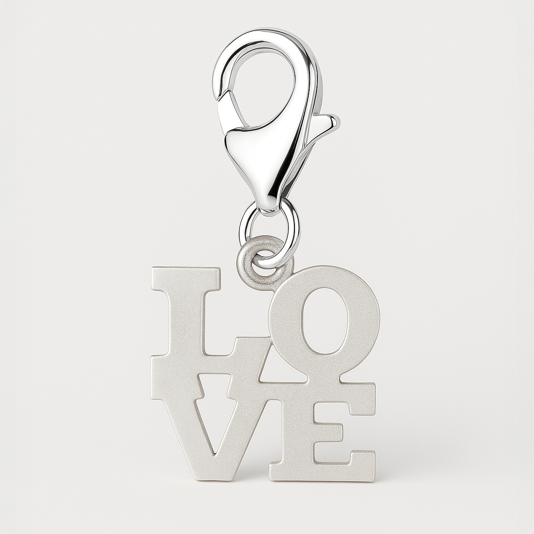Silver 'LOVE' charm with lobster clasp on a light grey background