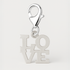Silver 'LOVE' charm with lobster clasp on a light grey background