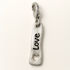 Silver charm with 'LOVE' engraving on a white background