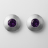 Pair of silver earrings with purple gemstones on a light grey background