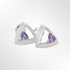 Pair of silver earrings with purple gemstones on a white background