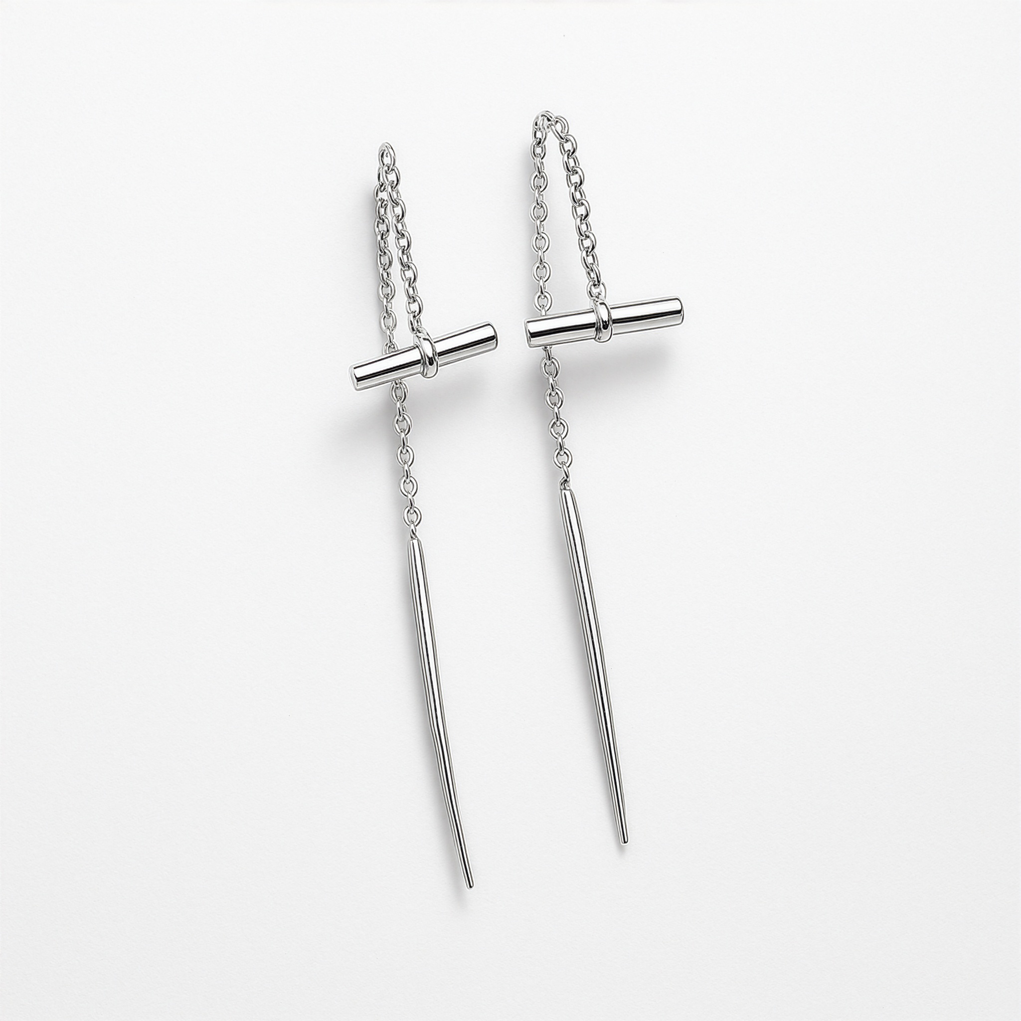 Pair of silver earrings with vertical bars on a light grey background