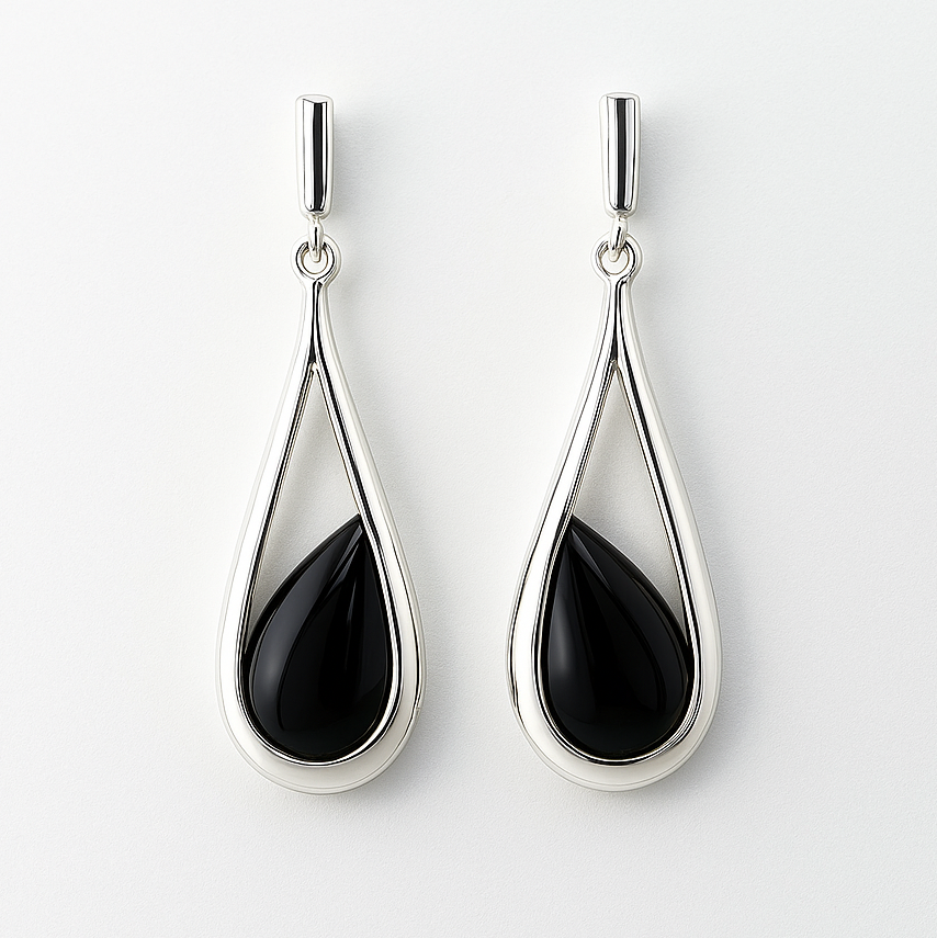 Teardrop-shaped earrings with black stones on a white background