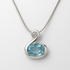 Silver pendant with a blue gemstone on a white background