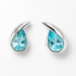 Teardrop-shaped earrings with blue gemstones on a white background