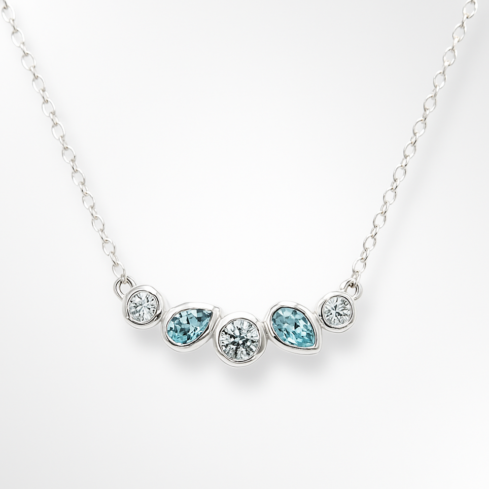 Necklace with blue and clear gemstones on a white background