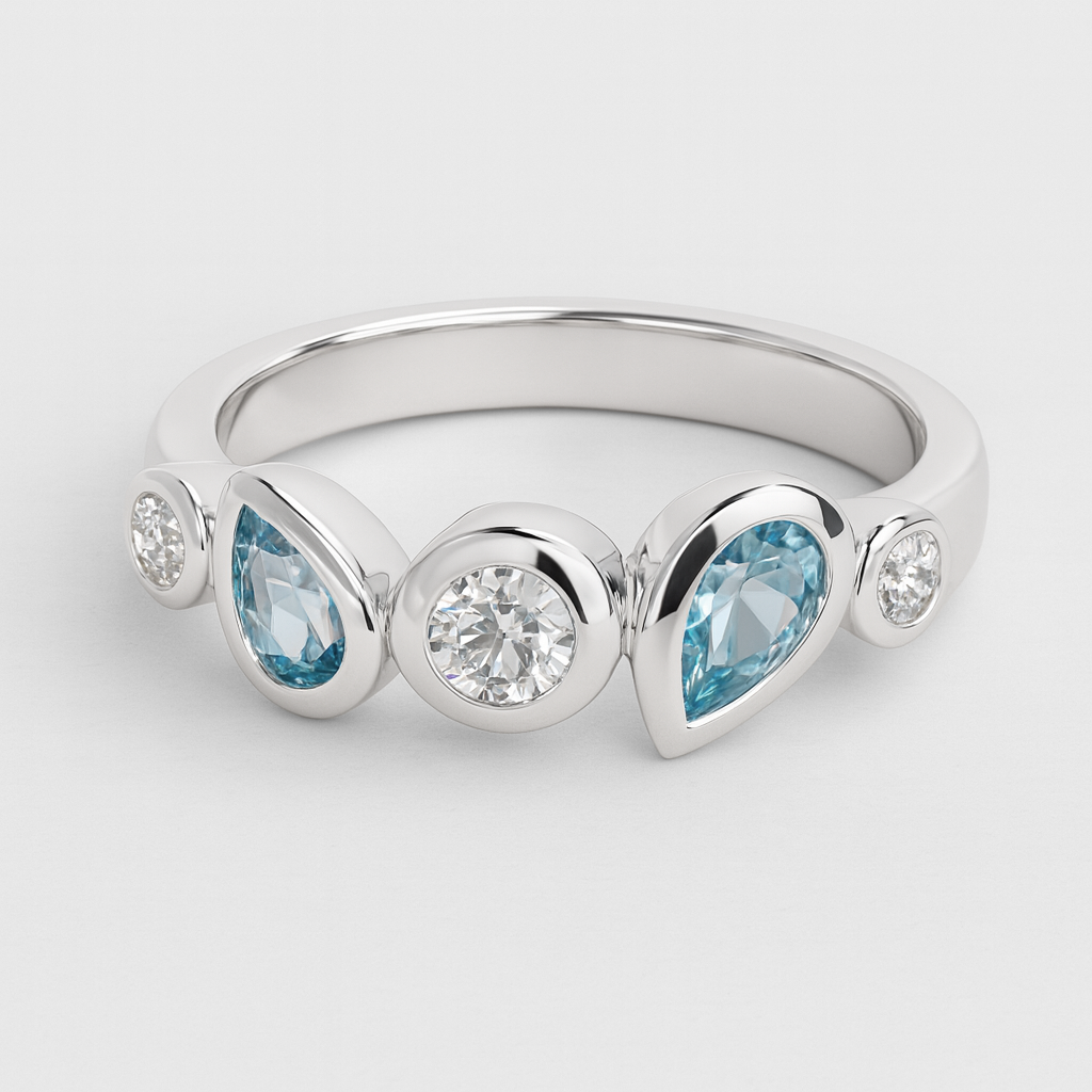 Silver ring with blue gemstones on a light grey background