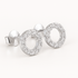 Silver circle earrings with clear gemstones on a white background