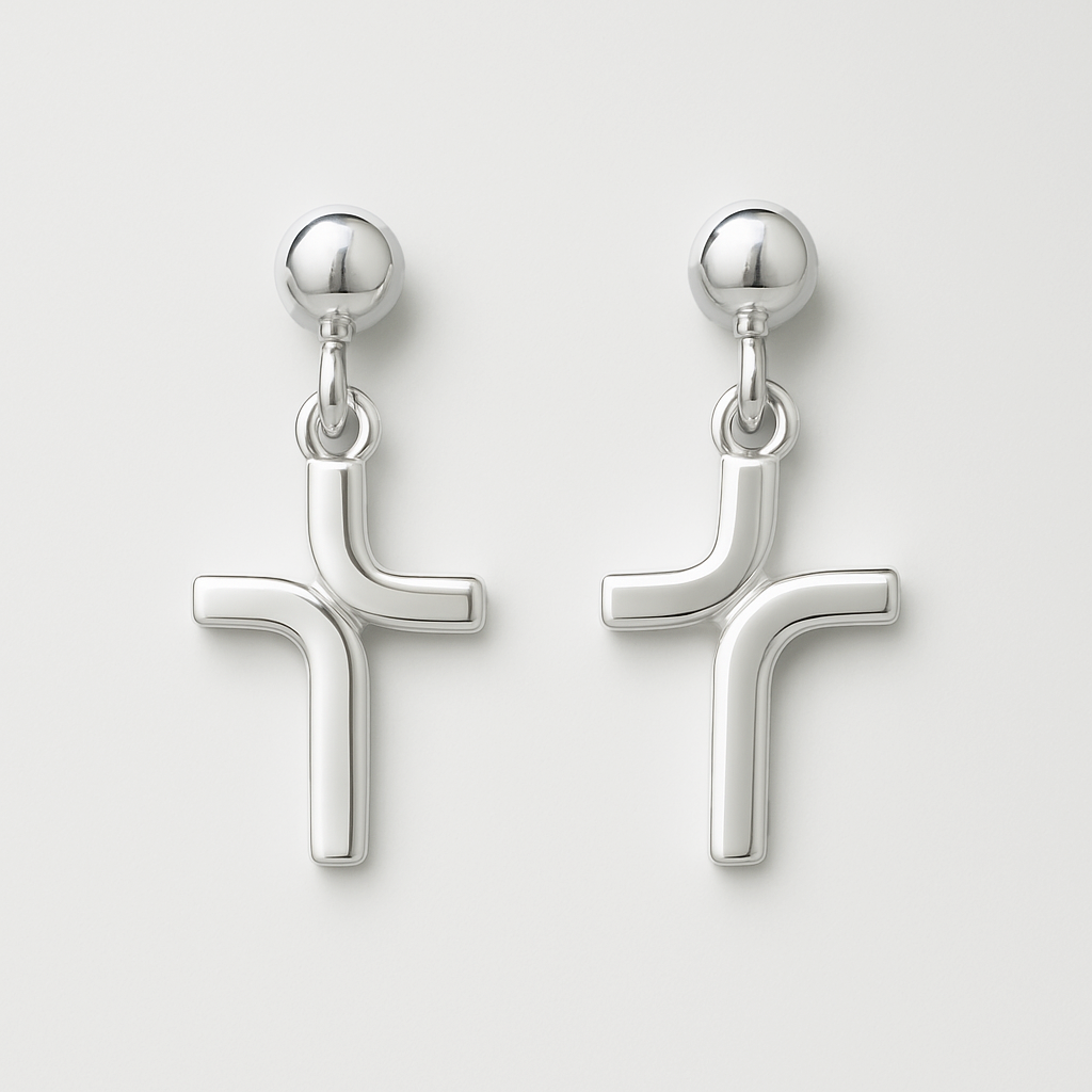 Pair of silver cross-shaped earrings on a light gray background