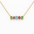 Gold necklace with five colored gemstones on a white background