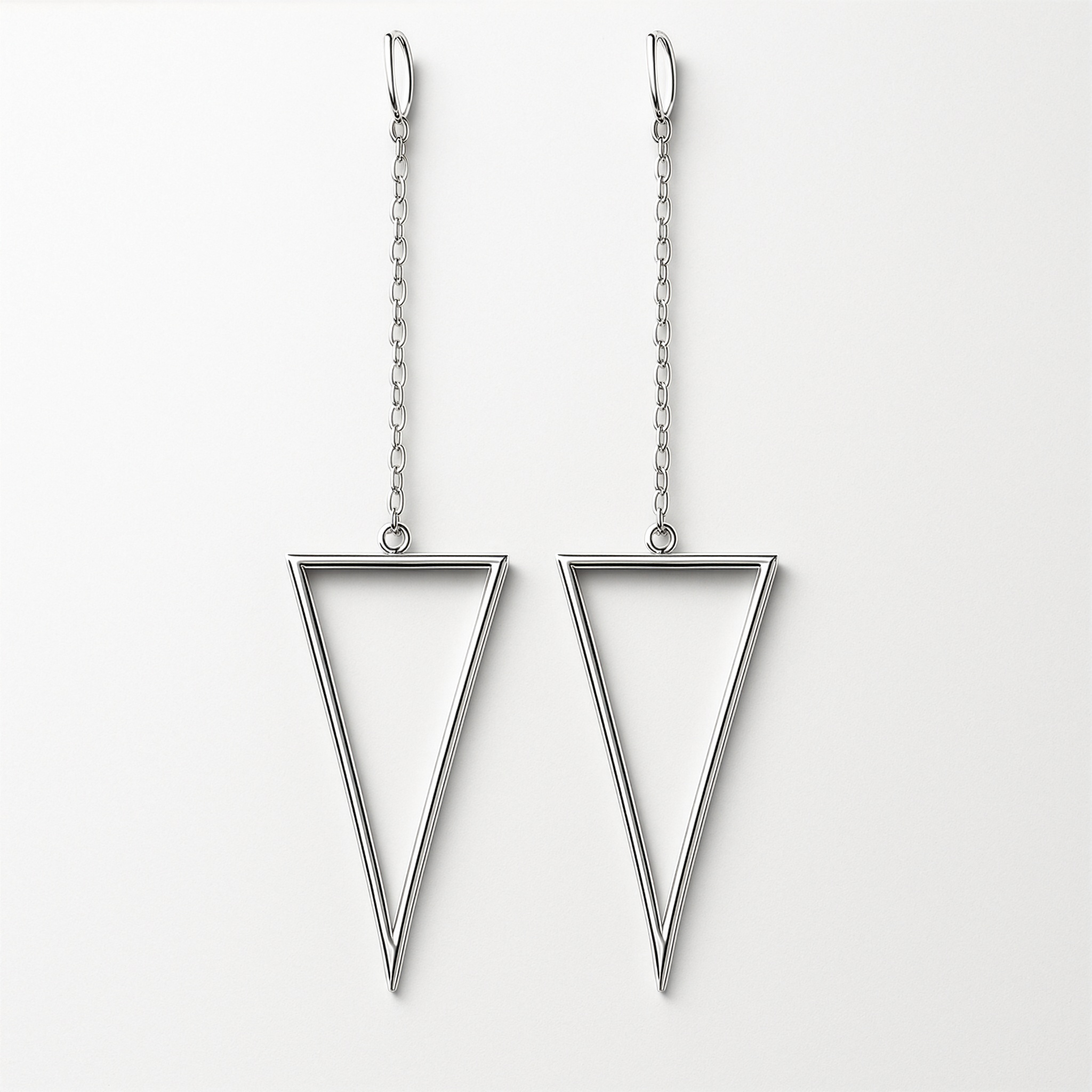 Pair of triangle-shaped earrings on a light grey background
