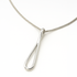 Silver necklace with a teardrop pendant on a white background