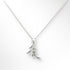 Silver necklace with a leaf-shaped pendant on a white background