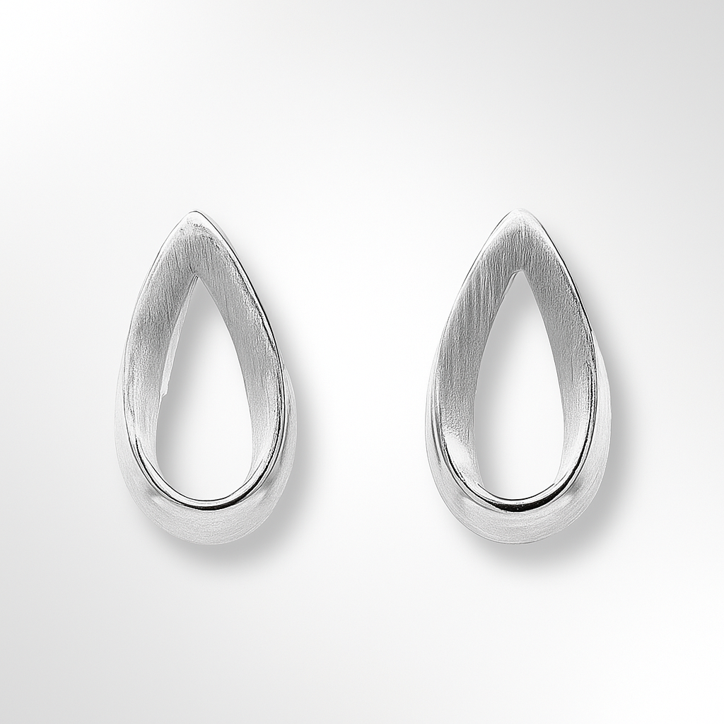 Teardrop-shaped silver earrings on a light grey background