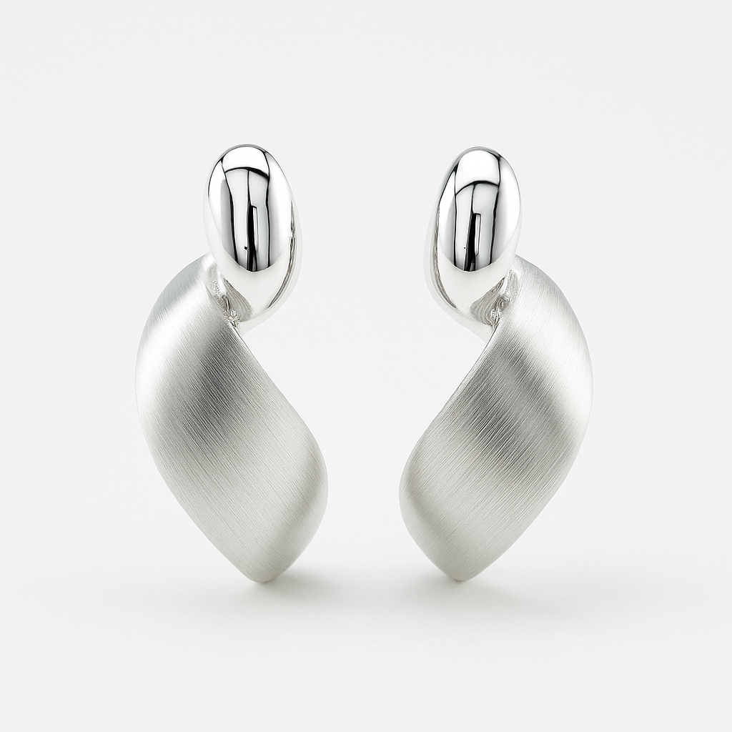 Pair of silver earrings on a white background