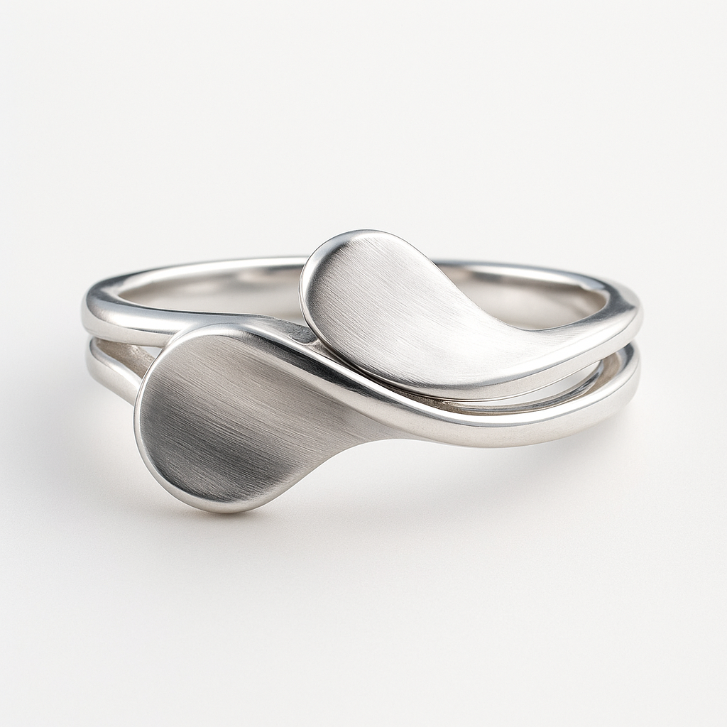 Silver ring with a modern design on a white background