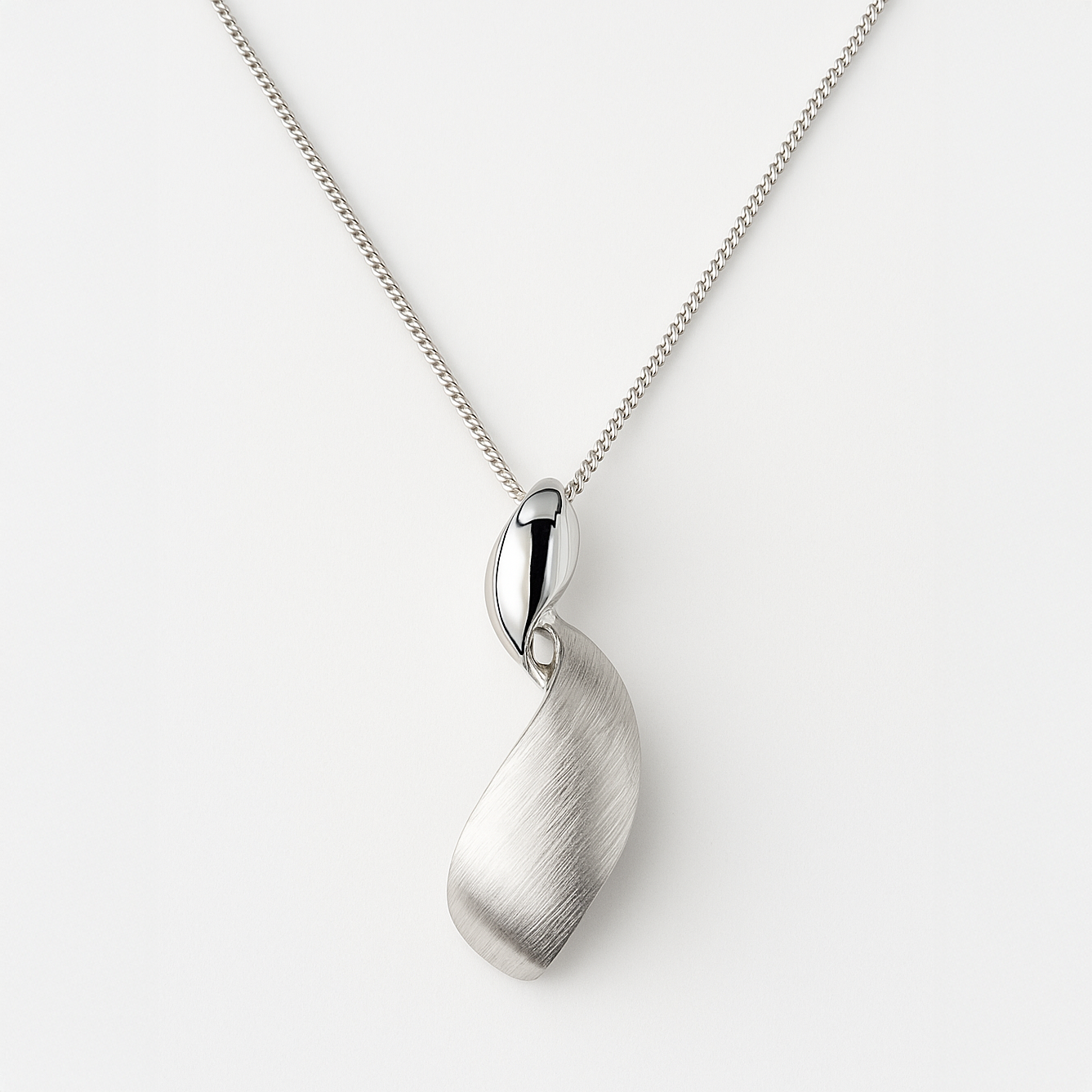 Silver pendant necklace on a white background