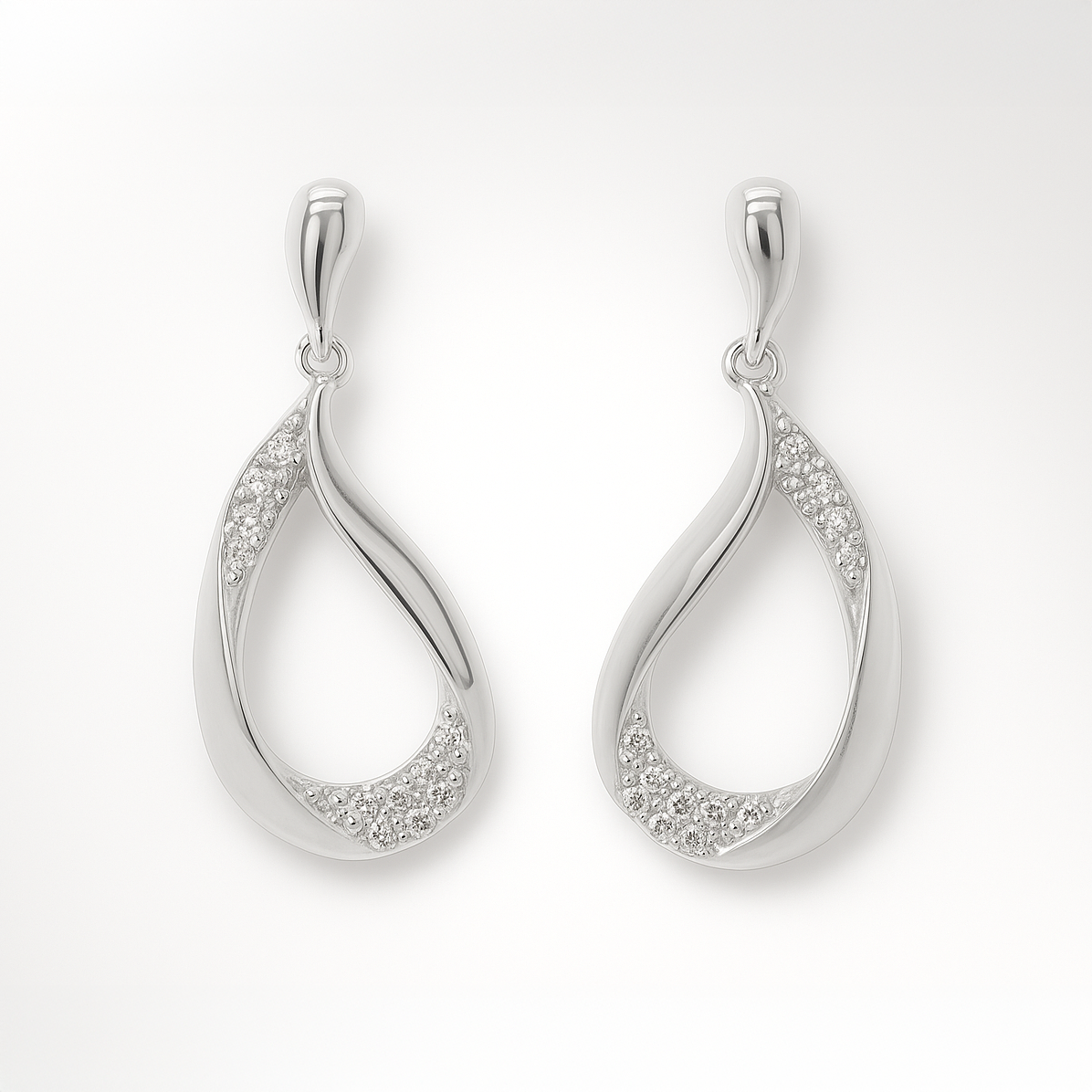 Pair of silver earrings with cubic zirconia accents on a white background