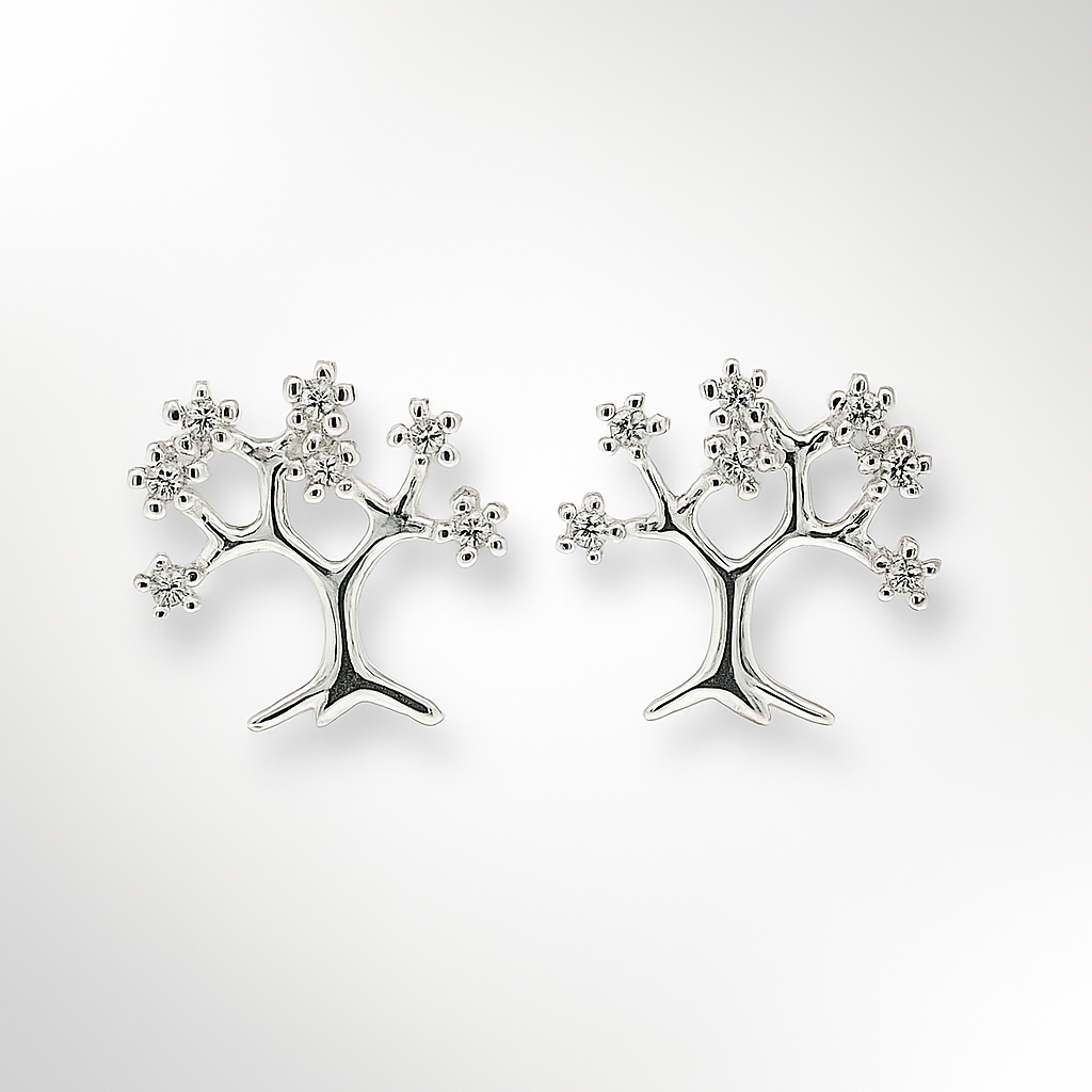 Silver tree-shaped earrings on a light grey background
