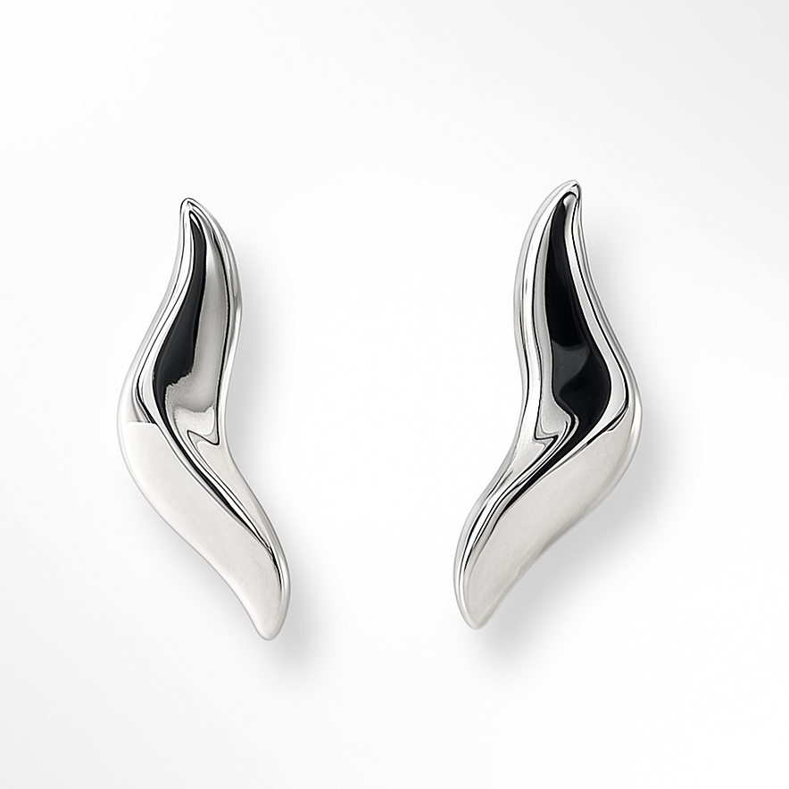 Pair of silver wing-shaped earrings on a white background